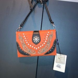 American Bling western crossbody swirl studded orange and black flip closure